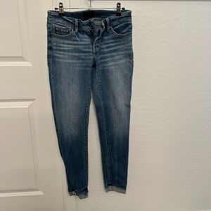 Buckle black ankle skinny jeans